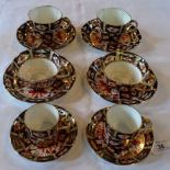 Three pairs of early 20th century Royal Crown Derby Imari cups and sauces, comprising: coffee cup,