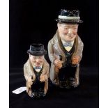 A pair of Royal Doulton graduated Winston Churchill toby jugs, no HN number, 23 cm & 14cm.