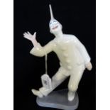 A Royal Copenhagen Pierrot clown figurine, no. 2353, by Edde Sadalin, 23cm.