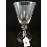 A mid-18th century wine glass of imposing proportions,