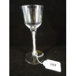 A wine glass with funnel bowl, the stem with an opaque gauze spiral on a compressed foot, 15.