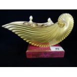 A 19th century porcelain inkstand, circa 1840, formed as a stylized nautilus shell, having inkwell,