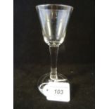 A wine glass, plain with funnel bowl and folded foot, circa 1765, 14.5cm high (firing faults).