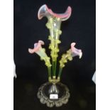 A late Victorian three branch epergne, having green opalescent flutes and cranberry rims,