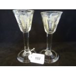 A pair of 18th century wine glasses,