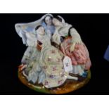 A 19th century Continental figural desk stand modelled as three young ladies,
