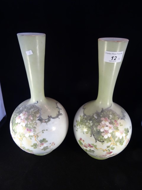 A pair of 19th century glass bottle vases,