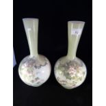 A pair of 19th century glass bottle vases,
