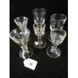 Two trumpet deception glasses, 11cm high, together with two others,