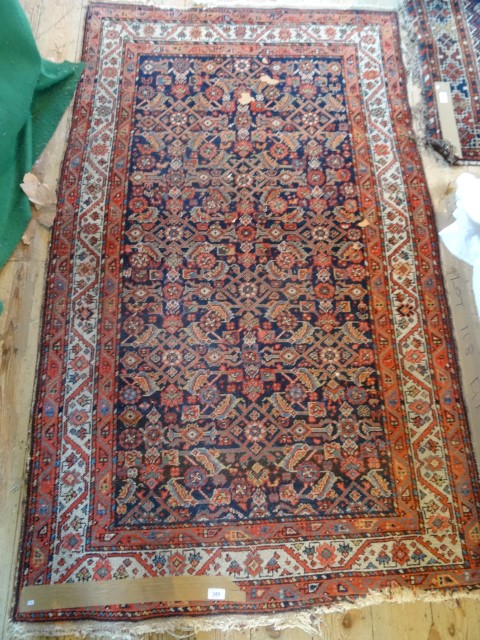 A 20th century Turkmen rug, 184cm x 112cm.