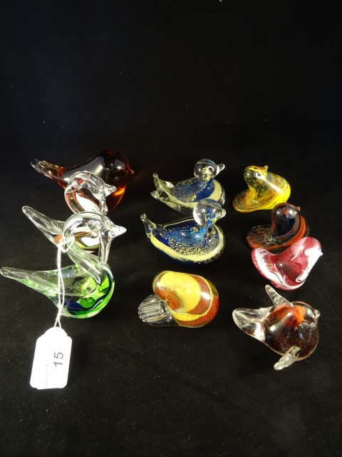 A collection of Continental glass paperweights, each modelled as birds,