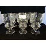 A collection of six Edwardian glass wine goblets,