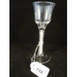 A wine glass with plain ogee bowl,