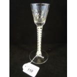 A 18th century cordial glass with spirally moulded bowl,