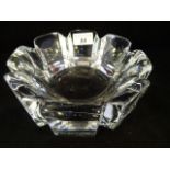 An Orrefors octagonal clear glass bowl, etched mark to base, 19cm diameter.