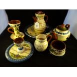 A collection of Devon Mottoware pottery, to include examples from Longpark,