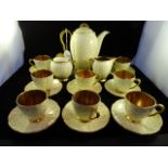 A Art Deco period Carlton Ware coffee set, decorated with hand painted polka dots on cream ground