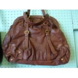 A ladies Prada brown soft leather handba