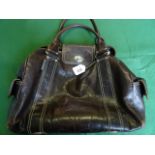 A ladies Orla Kiely brown leather handba