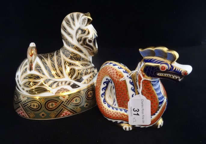 A Royal Crown Derby zebra paperweight with gold stopper,
