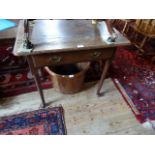 A 19th century oak single drawer side table on four tapering supports terminating in pad feet,