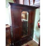 An Edwardian mahogany single mirrored door wardrobe, 154cm wide.