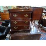 A reproduction three drawer small chest of drawers, 62cm wide.