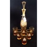 A Venetian glass decanter set with gilt hand painted floral decoration,