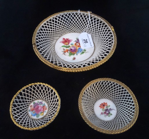 A collection of three 19th century Dresden pierced bowls, each with hand painted floral decoration