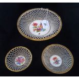 A collection of three 19th century Dresden pierced bowls, each with hand painted floral decoration