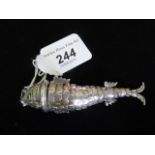 A vinaigrette/spice box formed as an articulated fish in white metal, having white stone eyes,