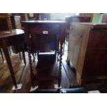 An oak two tier barley-twist occasional table.