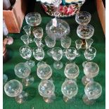A quantity of glassware to include: a tall stemmed decanter with etched floral decoration,