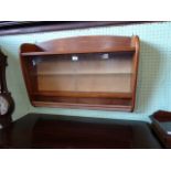 A 1950's display/trophy cabinet, having sliding glass drawers, 90cm wide.