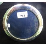 A contemporary circular silver picture frame, Sheffield hallmarks 16cm diameter.