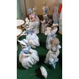 A collection of eight Nao figurines, various sizes, some with original boxes.