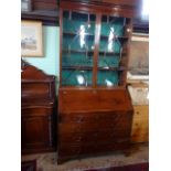 A Georgian mahogany bureau bookcase, having astral glazed doors,