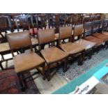 A set of four 20th century oak dining chairs,