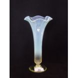 A vaseline glass trumpet vase, with wavy edge rim on circular foot, 22cm. Condition Report: Good