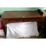 A Victorian mahogany two drawer writing table on reeded supports, 116cm wide.