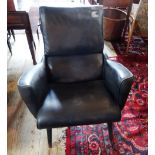 A late 20th century ercol-style lounge chair upholstered in black simulated leather, 75cm wide.