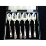 Eleven silver teaspoons in fitted case in two designs, Sheffield hallmarks 1933 & 1938.