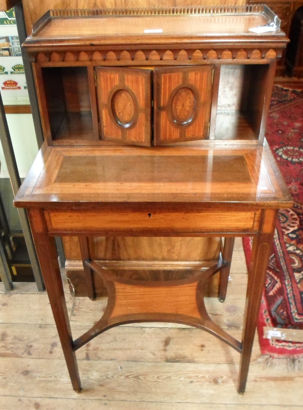 An Edwardian ladies writing desk, cross-banded and inlaid decoration,