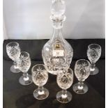 A hand cut Edinburgh crystal glass decanter and stopper, together with six matching sherry glasses.