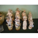 Twelve Continental bisque and ceramic figurines, various sizes.