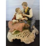 A 19th century Chelsea-style porcelain figure group of a courting couple,