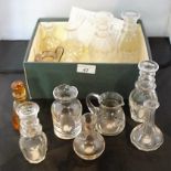 A collection of individual glass decanters, to include: an amber coloured Whitefriars single tot