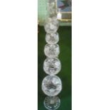 A cut glass decanter, having loop handle over globular body,