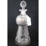 An early 20th century thistle shaped cut glass decanter,