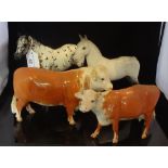 A large Beswick bull, together with a Beswick cow and two Beswick horses. Condition Report: Large